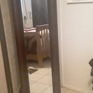 A mirror 5 feet long 1 foot wide